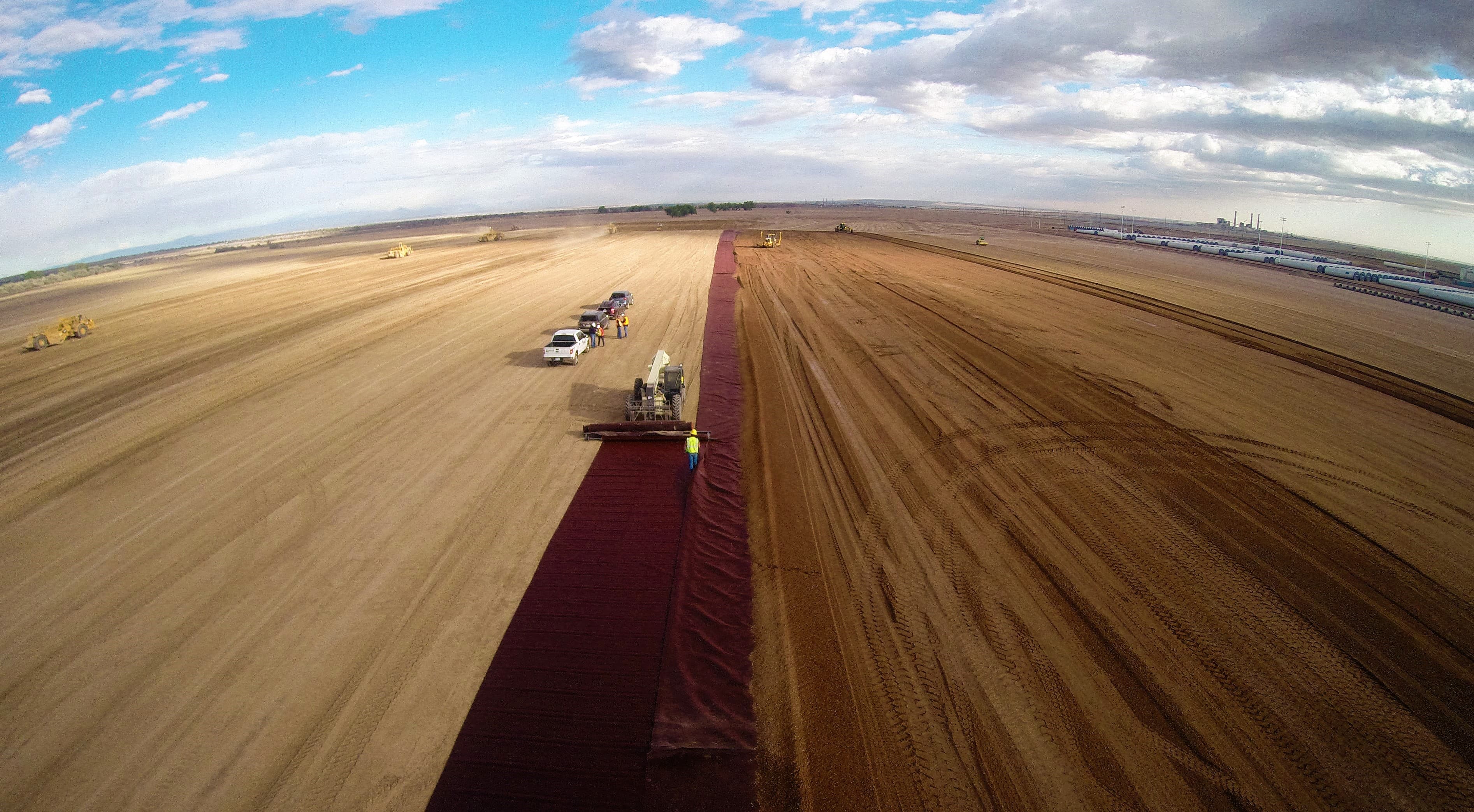 To handle high winds during installation, crews used pins at intervals and transitioned to a spreader bar for faster deployment.
