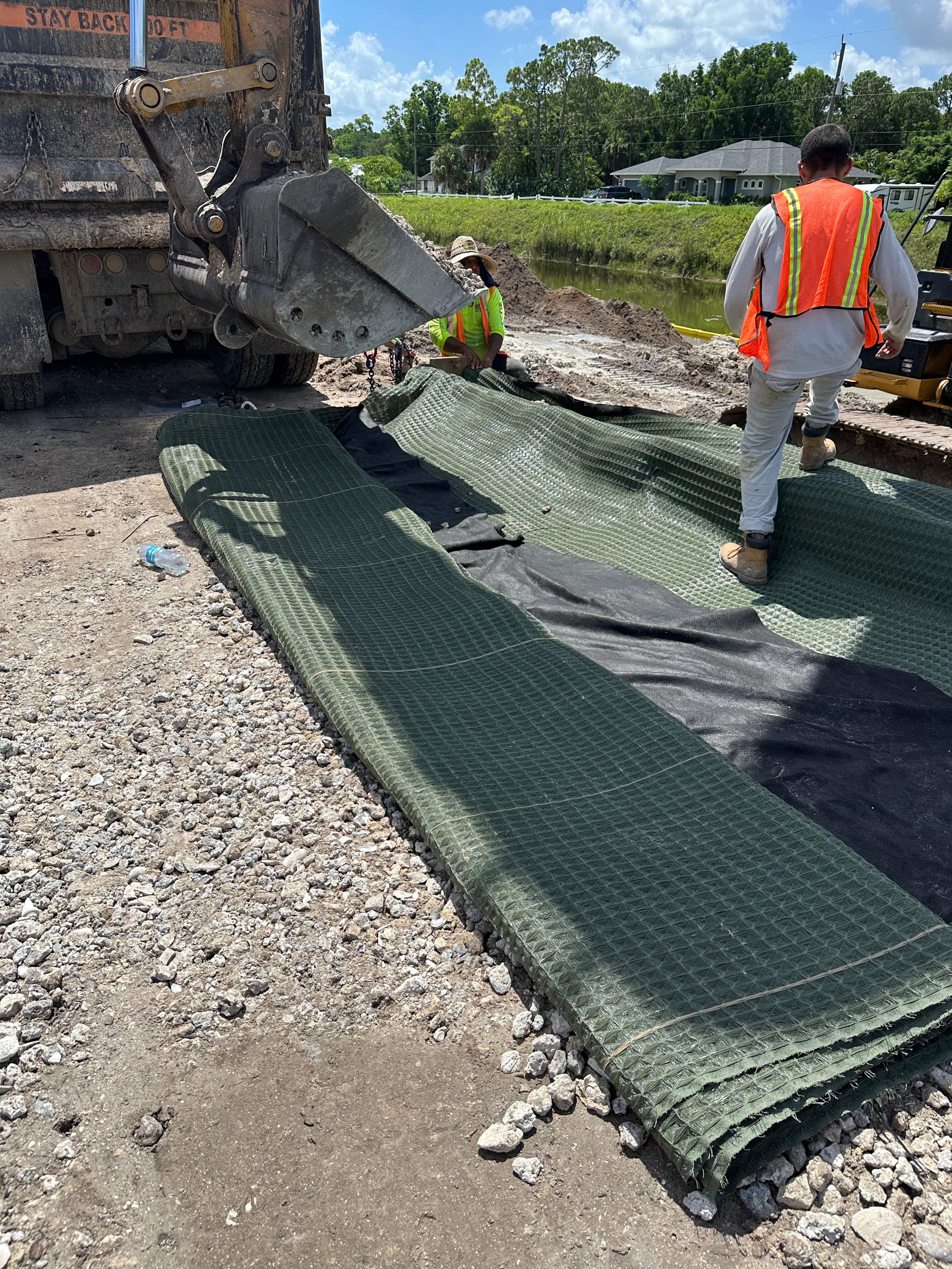 Created and placed burrito-wrap rock structures using MIRAFI 160N and PROPEX Pyramat 75 at the toe of the slope.
